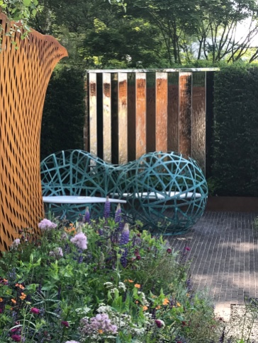 Corten Steel arch with copper and corian bench in the David Harber Garden